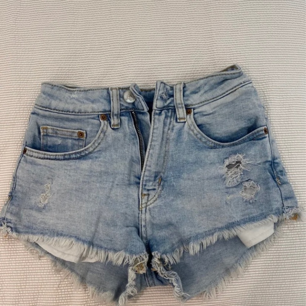 Ripped denim shorts by divided. Size small.